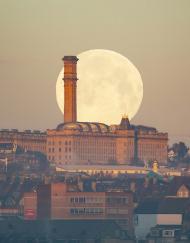 Wolf Moon setting behind Lister Mill