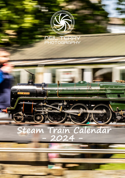 Image shows the cover of Neil Terry Photography's Steam Train 2024 calendar which shows a 7 inch gauge locomotive 'Robin Hood' at speed with a blurred backgroung
