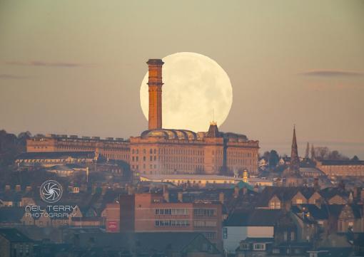 Wolf Moon setting behind Lister Mill