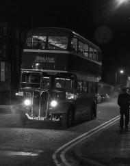 vintage bus at night with a low mist being shown in the headlights